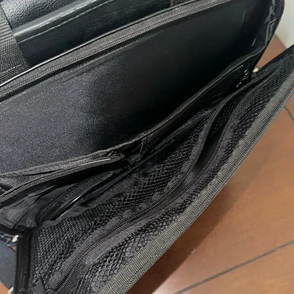 TARGUS Black Tech Padded Faux Leather Laptop Travel Bag with a Crossbody Strap